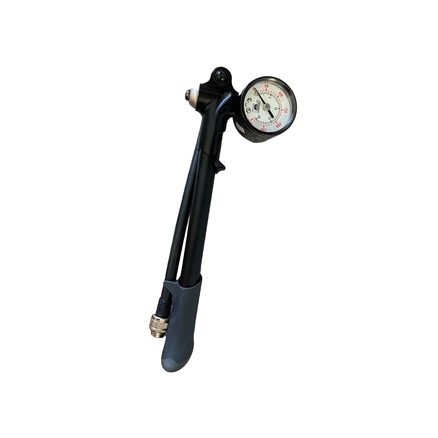 A black pneumatic snowmobile suspension inflator with an attached round pressure gauge, featuring a gray foot pedal and metal valve connector, isolated on a white background.